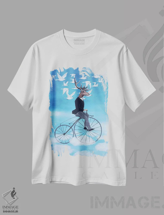 تیشرت سفید طرح دار گوزن رویاپرداز در حال دوچرخه سواری، تزئینی اثر کوکو د پاریس | immage.ir