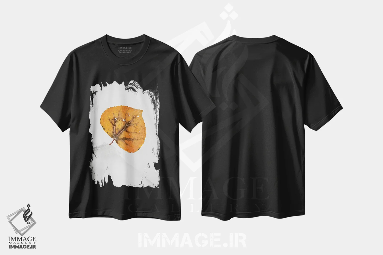 تیشرت مشکی طرح دار برگ نارنجی روی تپه برفی، عکاسی ماکرو اثر نیک ریو | فروشگاه ایماژ