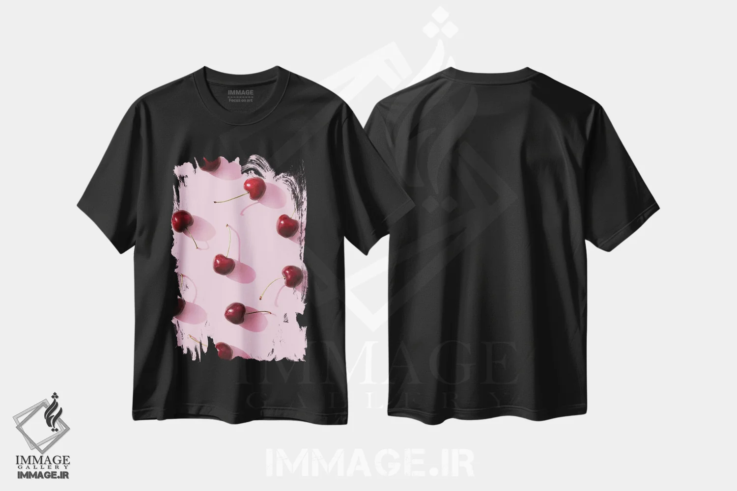 تیشرت مشکی طرح دار آلبالو روی زمینه صورتی، عکاسی ماکرو اثر استودیو ۱ایکس ۲ | immage.ir