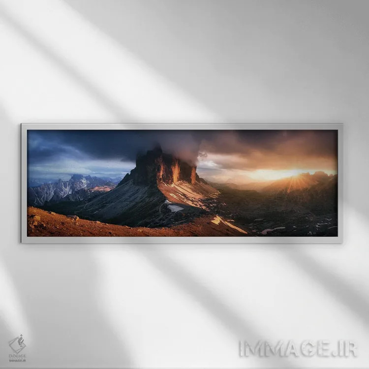 تابلو نور دراماتیک پس از باران در تره چیمه دی لاواردو (دولومیت) اثر دنیل گاستاگر - نمای قابدار سفید