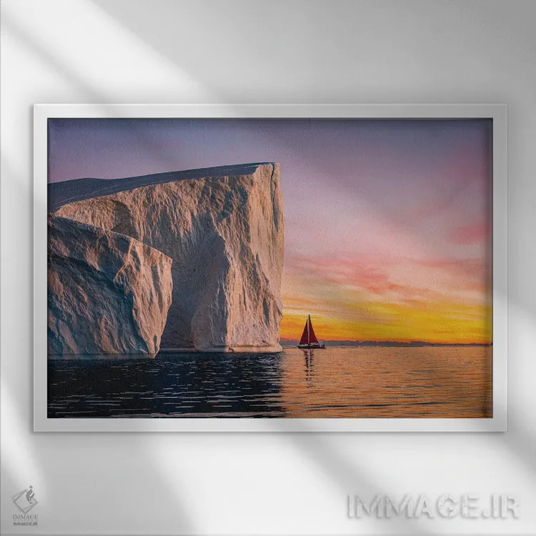 تابلو غروب قایق بادبانی قرمز کنار کوه یخی گرینلند (قسمت چهارم) اثر الکس جی پرز - نمای قابدار سفید