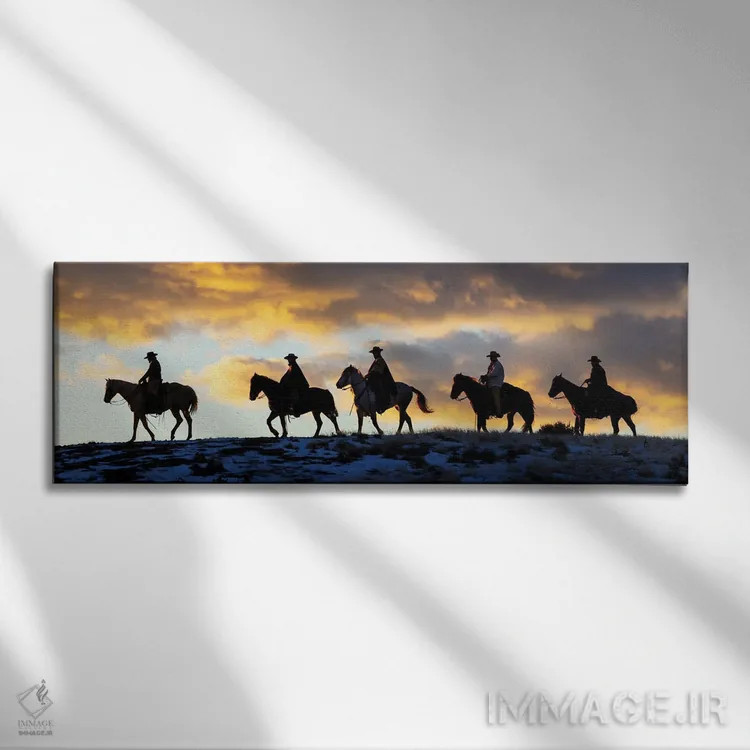 تابلو Shell, Wyoming Hideout Ranch Cowboys And Cowgirls Silhouetted Against Sunset Riding On Ridgeline II,آمریکا، شل، وایومینگ، کابویها و کابوی دختران در حال سواری سیلوئتشده مقابل غروب بر خطالرأس ۲ اثر دارل گالین - نمای روبهرو روی دیوار