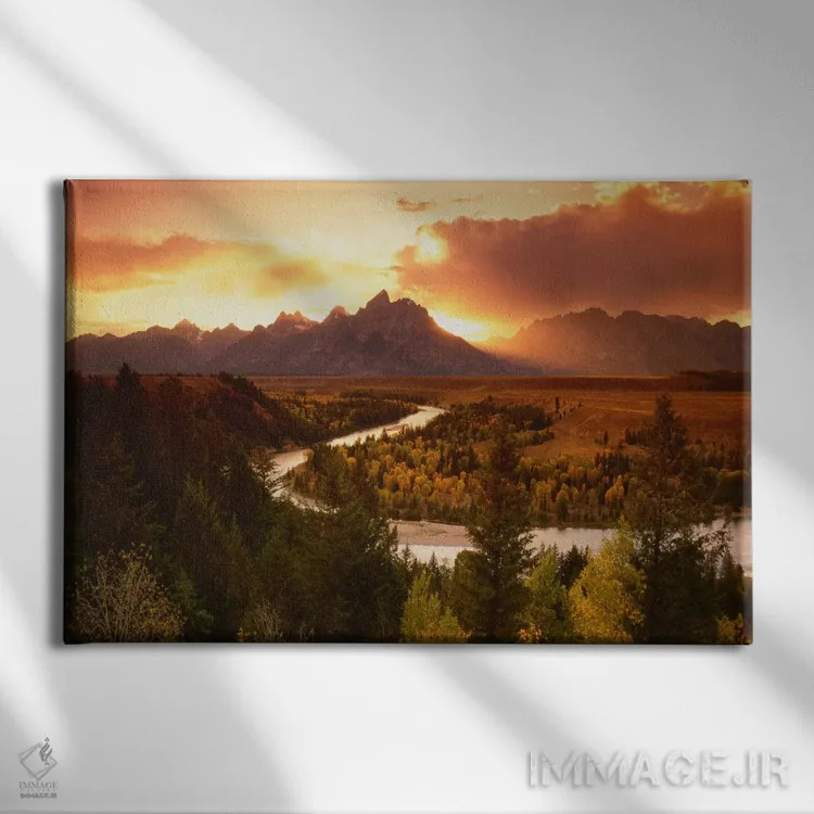 تابلو غروب بر فراز رشتهکوه تتون با رودخانه اسنیک در پیشزمینه، پارک ملی گرند تتون، وایومینگ، آمریکا اثر آدام جونز - نمای روبهرو روی دیوار