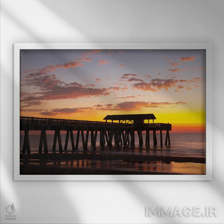 تابلو Georgia, Silhouette Of A Pier In The Sunrise, Near Savannah,آمریکا، جورجیا. سیلوئت اسکله در طلوع خورشید، حوالی ساوانا اثر جوآن ولز - نمای قابدار سفید