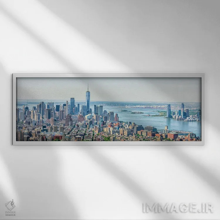 تابلو منظره پانورامای پایین منهتن اثر مانجیک پیکچرز (استودیو عکاسی یا فیلمسازی) - نمای قابدار سفید