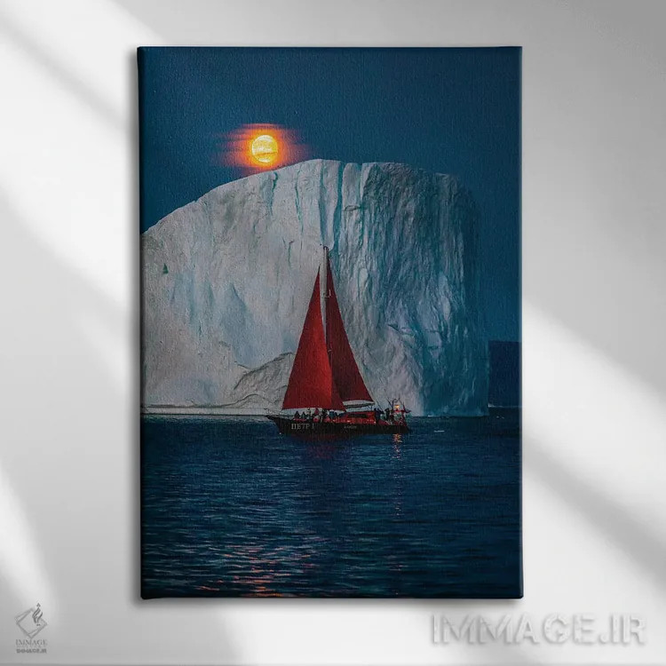 تابلو قایق بادبانی قرمز کنار کوه یخی گرینلند با ماه کامل سرخ (قسمت دوم) اثر الکس جی پرز - نمای روبهرو روی دیوار