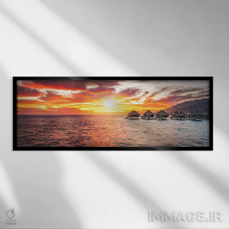 تابلو Bora Bora Atoll,خانههای چوبی روی آب هنگام غروب در آتول بورا بورا اثر یان بکه - نمای قابدار مشکی