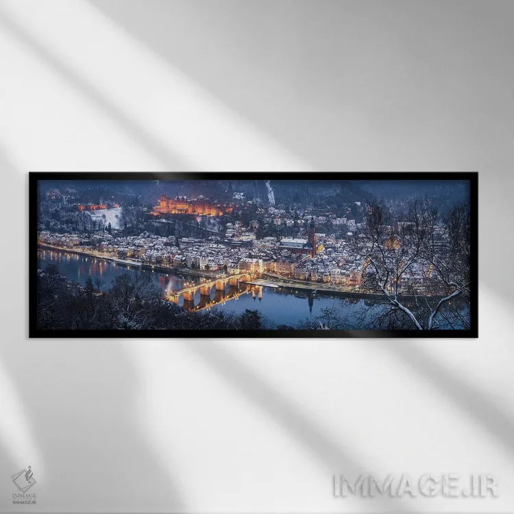 تابلو منظره پانورامای شهر قدیمی هایدلبرگ در زمستان با منظره پل قدیمی و قلعه اثر یان بکه - نمای قابدار مشکی