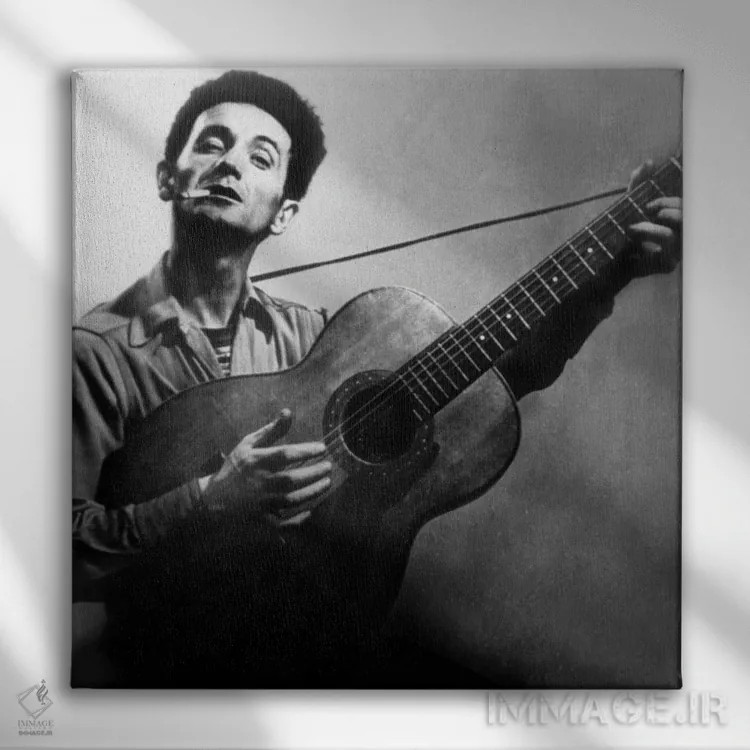 تابلو وودی گاتری، موسیقیدان و پدر ترانهسرایی فولک، حدود ۱۹۴۰ اثر رو دز آرشیو (آرشیو خیابان) - نمای روبهرو روی دیوار