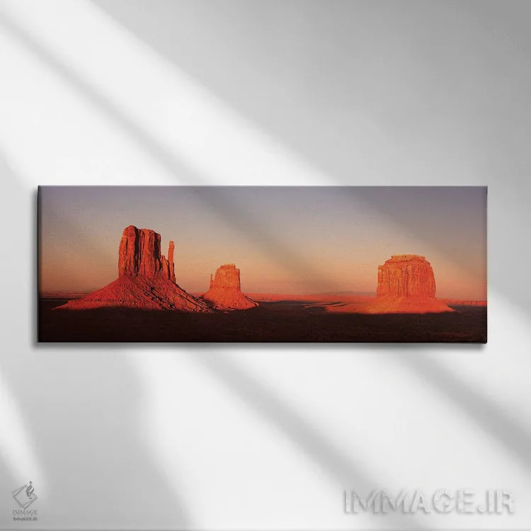 تابلو پانورامای دره یادبود در غروب (Monument Valley) اثر جین ریکس - نمای روبهرو روی دیوار
