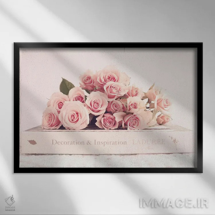 تابلو گل صدتومانی و کتاب اثر کارولین مینت - نمای قابدار مشکی