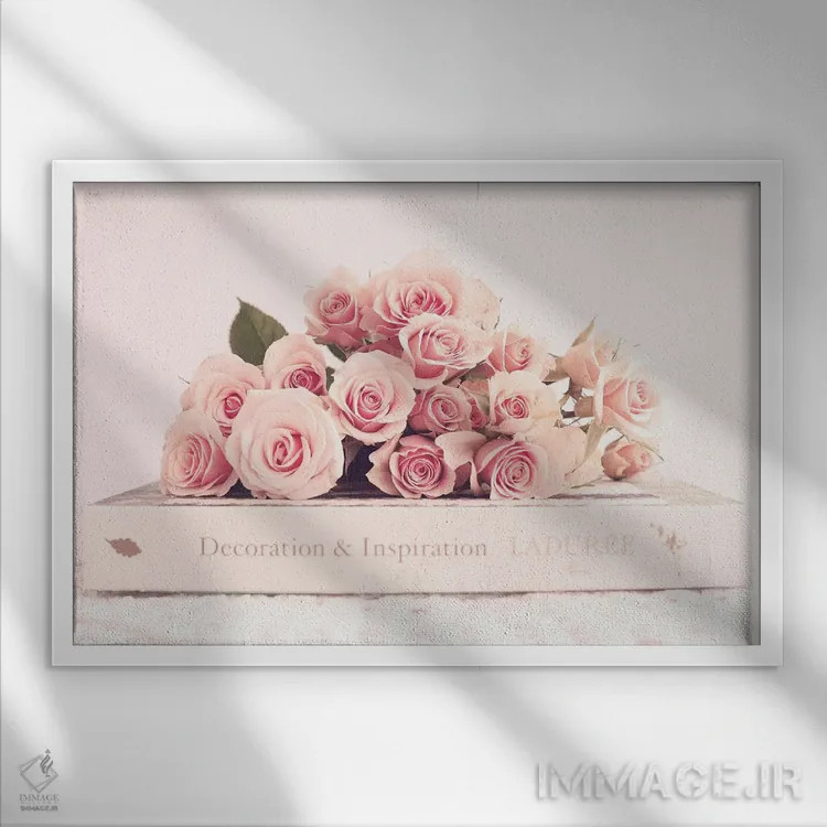 تابلو گل صدتومانی و کتاب اثر کارولین مینت - نمای قابدار سفید