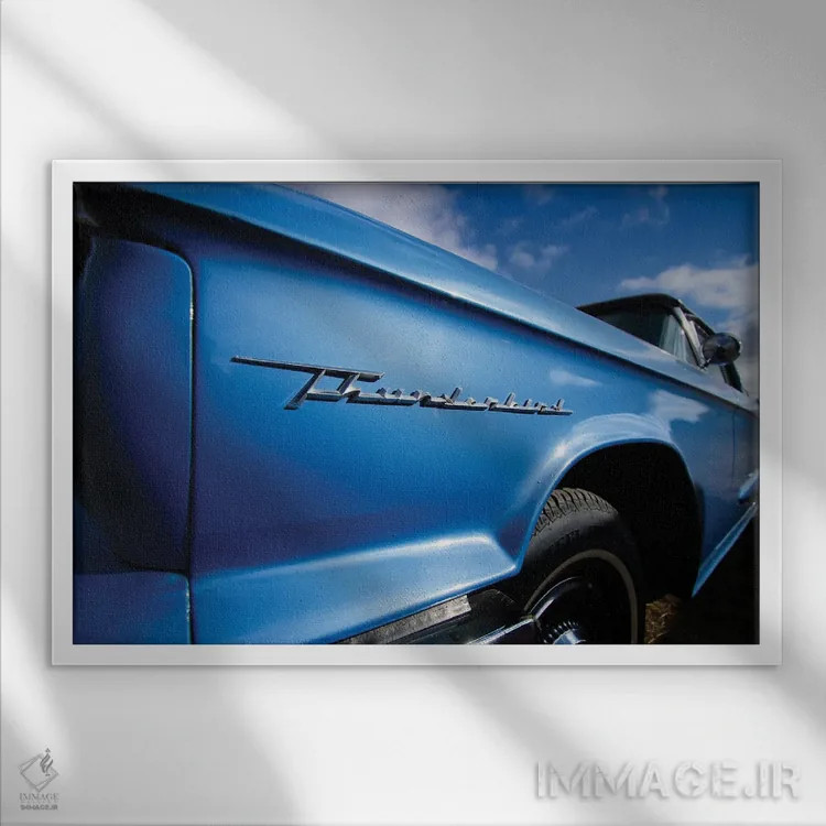 تابلو تاندربرد آبی آسمانی (خودرو مشهور) اثر کریستوفر توماس - نمای قابدار سفید