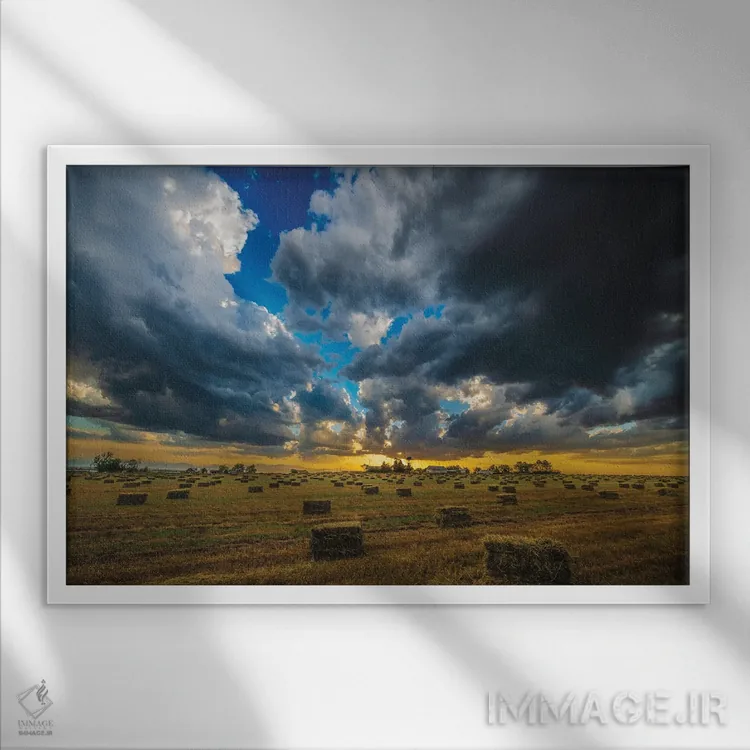 تابلو غروب برداشت یونجه اثر کریستوفر توماس - نمای قابدار سفید