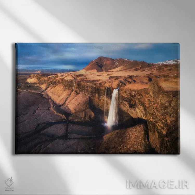 تابلو نمای پانورامای آبشار سلژالاندفوس (ایسلند) اثر دنیل گاستاگر - نمای روبهرو روی دیوار