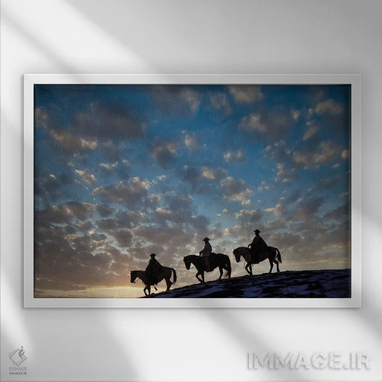 تابلو Shell, Wyoming Hideout Ranch Cowboys And Cowgirls Silhouetted Against Sunset Riding On Ridgeline I,آمریکا، شل، وایومینگ، کابویها و کابوی دختران در حال سواری سیلوئتشده مقابل غروب بر خطالرأس ۱ اثر دارل گالین - نمای قابدار سفید