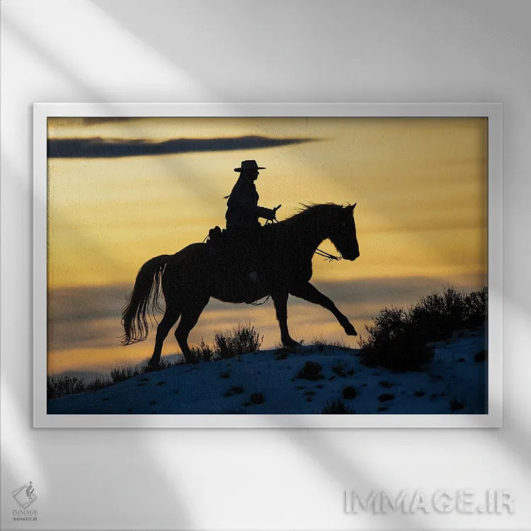 تابلو Shell, Wyoming Hideout Ranch Cowgirl Silhouetted On Horseback At Sunset I,آمریکا، شل، وایومینگ، کابوی دختر سیلوئتشده روی اسب هنگام غروب ۱ اثر دارل گالین - نمای قابدار سفید
