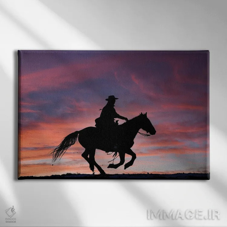 تابلو Shell, Wyoming Hideout Ranch Cowgirl Silhouetted On Horseback At Sunset III,آمریکا، شل، وایومینگ، کابوی دختر سیلوئتشده روی اسب هنگام غروب ۳ اثر دارل گالین - نمای روبهرو روی دیوار