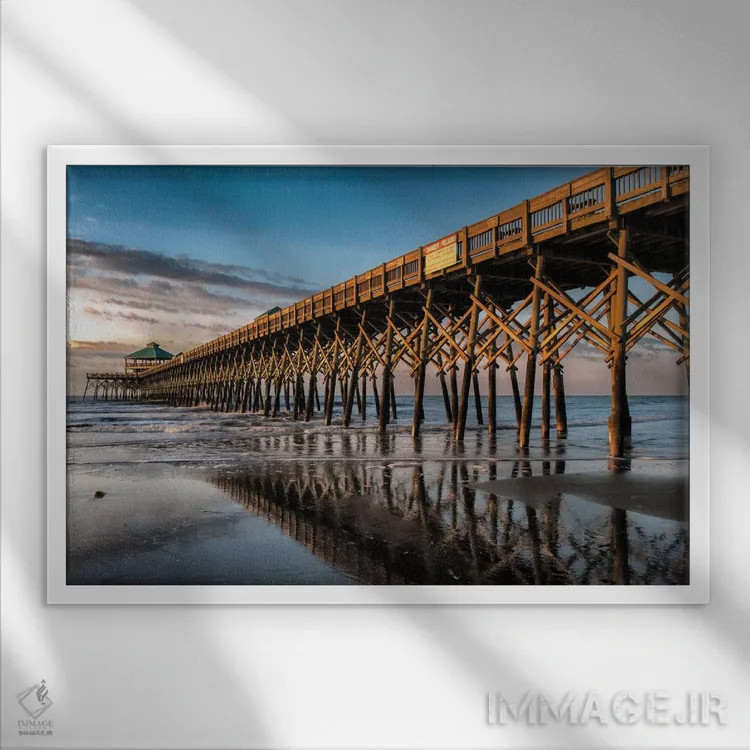 تابلو آفتاب گرفتن در ساحل فالی اثر دنی هد - نمای قابدار سفید