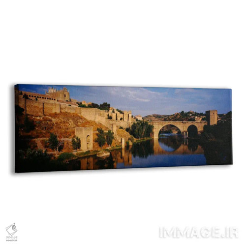 تابلو Toledo, Spain" - "منظره تاریخی در کنار رودخانه ریو تاجو با پل سن مارتین، تولدو، اسپانیا" اثر پانورامیک ایمجز (استودیو عکاسی عریض) - نمای پرسپکتیو محصول