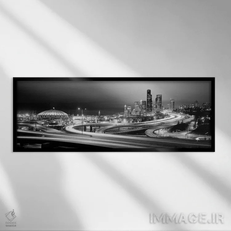 تابلو ساختمانها روشن شده در شب، سیاتل، ایالت واشنگتن، ایالات متحده آمریکا (سیاه و سفید) اثر پانورامیک ایمجز (استودیو عکاسی عریض) - نمای قابدار مشکی