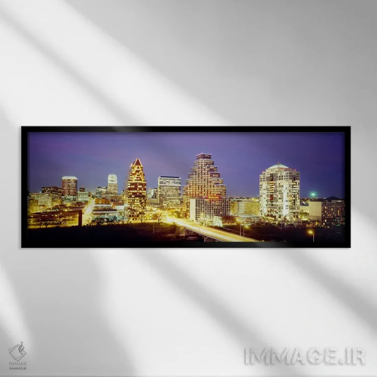 تابلو ساختمانها که در غروب روشن شدهاند، آستین، تگزاس، ایالات متحده آمریکا اثر پانورامیک ایمجز (استودیو عکاسی عریض) - نمای قابدار مشکی