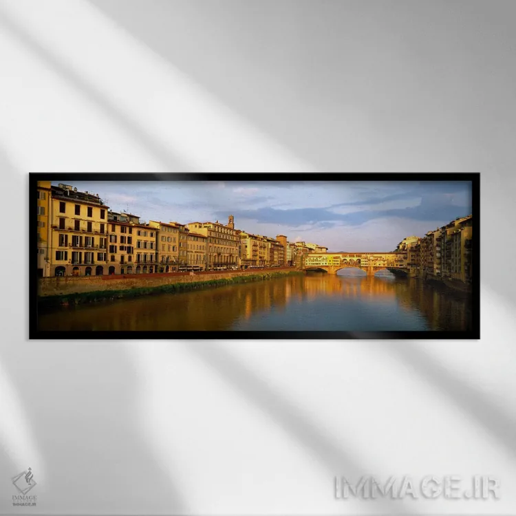 تابلو Arno River, Florence, Tuscany, Italy" - "معماری کنار رودخانه و پل وکیو، رودخانه آرنو، فلورانس، توسکانی، ایتالیا" اثر پانورامیک ایمجز (استودیو عکاسی عریض) - نمای قابدار مشکی
