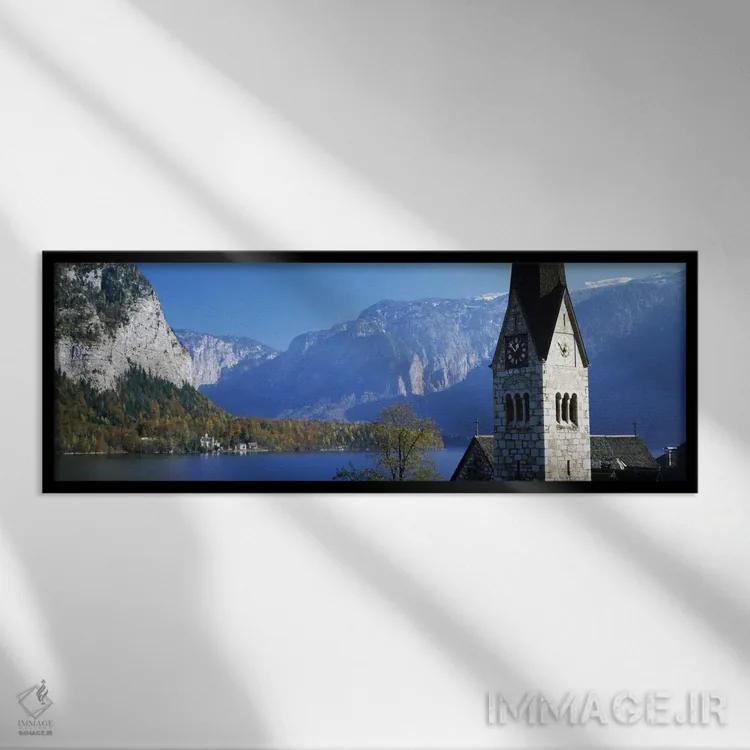 تابلو Hallstatt, Salzkammergut, Austria" - "کلیسا در کنار دریاچه، هالشتات، سالزکامراگوت، اتریش" اثر پانورامیک ایمجز (استودیو عکاسی عریض) - نمای قابدار مشکی