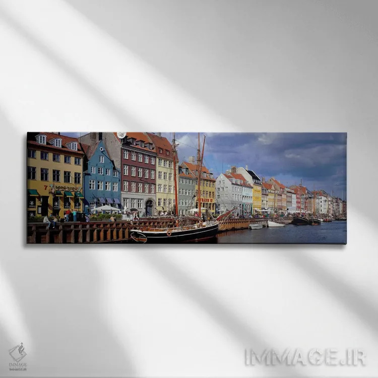 تابلو Nyhavn, Copenhagen, Denmark" - "خانههای کنار آب رنگارنگ، نیهاون، کپنهاگ، دانمارک" اثر پانورامیک ایمجز (استودیو عکاسی عریض) - نمای روبهرو روی دیوار