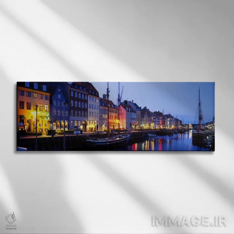 تابلو Nyhavn, Copenhagen, Denmark" - "خانههای کنار آب، نیهاون، کپنهاگ، دانمارک" اثر پانورامیک ایمجز (استودیو عکاسی عریض) - نمای روبهرو روی دیوار