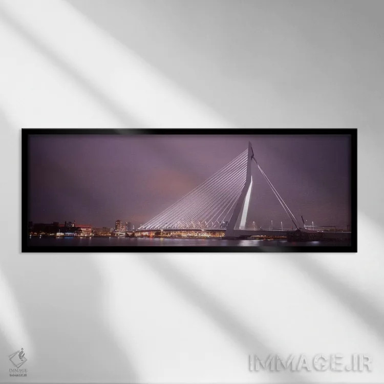 تابلو Rotterdam, Netherlands" - "پل ارسموس روشنشده در شب، روتردام، هلند" اثر پانورامیک ایمجز (استودیو عکاسی عریض) - نمای قابدار مشکی