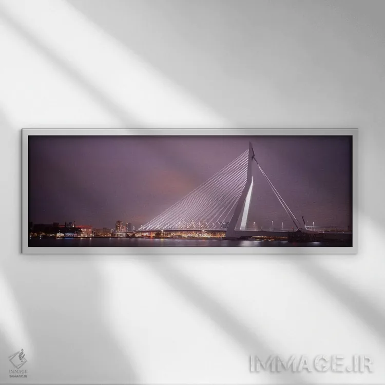 تابلو Rotterdam, Netherlands" - "پل ارسموس روشنشده در شب، روتردام، هلند" اثر پانورامیک ایمجز (استودیو عکاسی عریض) - نمای قابدار سفید