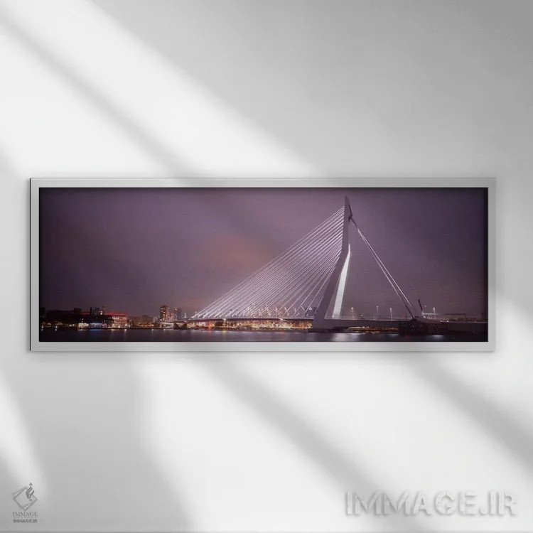 تابلو Rotterdam, Netherlands" - "پل ارسموس روشنشده در شب، روتردام، هلند" اثر پانورامیک ایمجز (استودیو عکاسی عریض) - نمای قابدار سفید