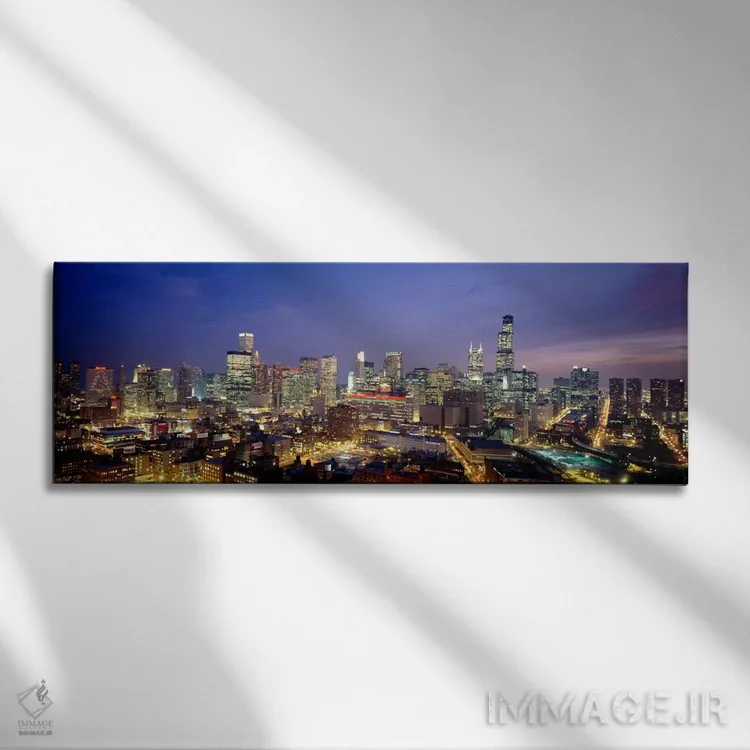 تابلو نمای بالا از ساختمانها روشنشده در غروب، شیکاگو، ایلینوی، ایالات متحده اثر پانورامیک ایمجز (استودیو عکاسی عریض) - نمای روبهرو روی دیوار