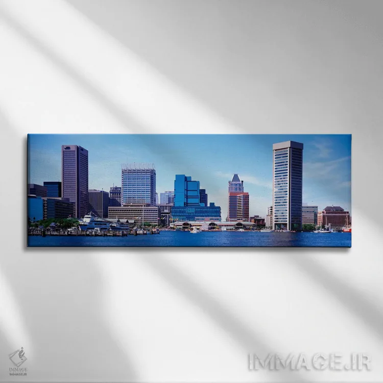 تابلو ایالات متحده، مریلند، بالتیمور، آسمانخراشها در امتداد بندر داخلی اثر پانورامیک ایمجز (استودیو عکاسی عریض) - نمای روبهرو روی دیوار