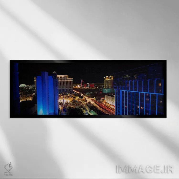 تابلو ساختمانهای روشن شده در شب، لاسوگاس، نواد، ایالات متحده آمریکا اثر پانورامیک ایمجز (استودیو عکاسی عریض) - نمای قابدار مشکی