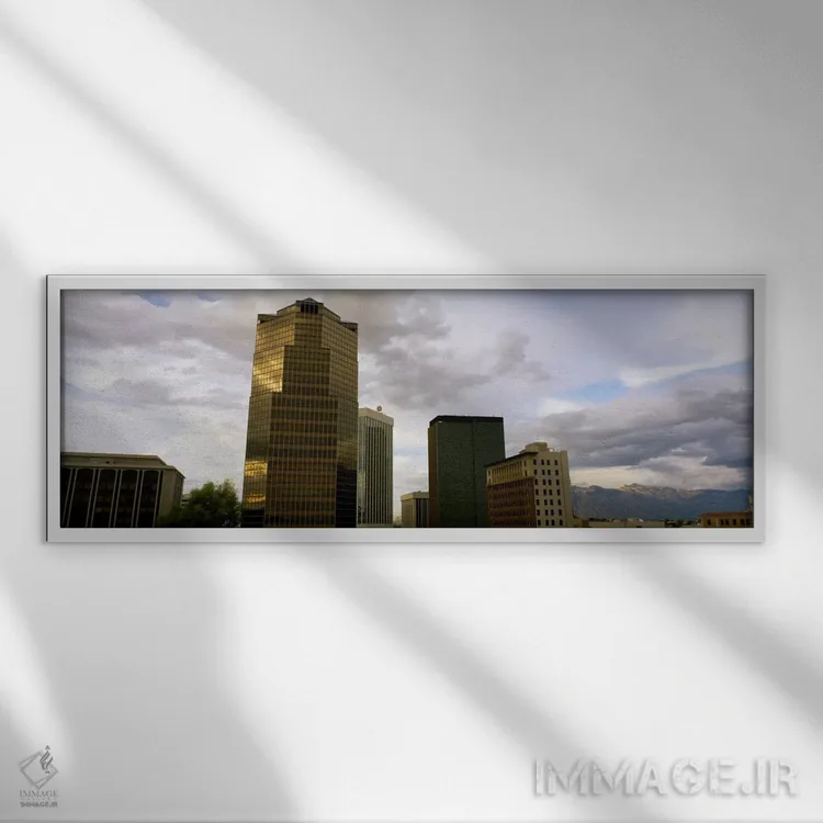 تابلو ساختمانها در یک شهر با کوهها در پسزمینه، توسان، آریزونا، ایالات متحده آمریکا اثر پانورامیک ایمجز (استودیو عکاسی عریض) - نمای قابدار سفید