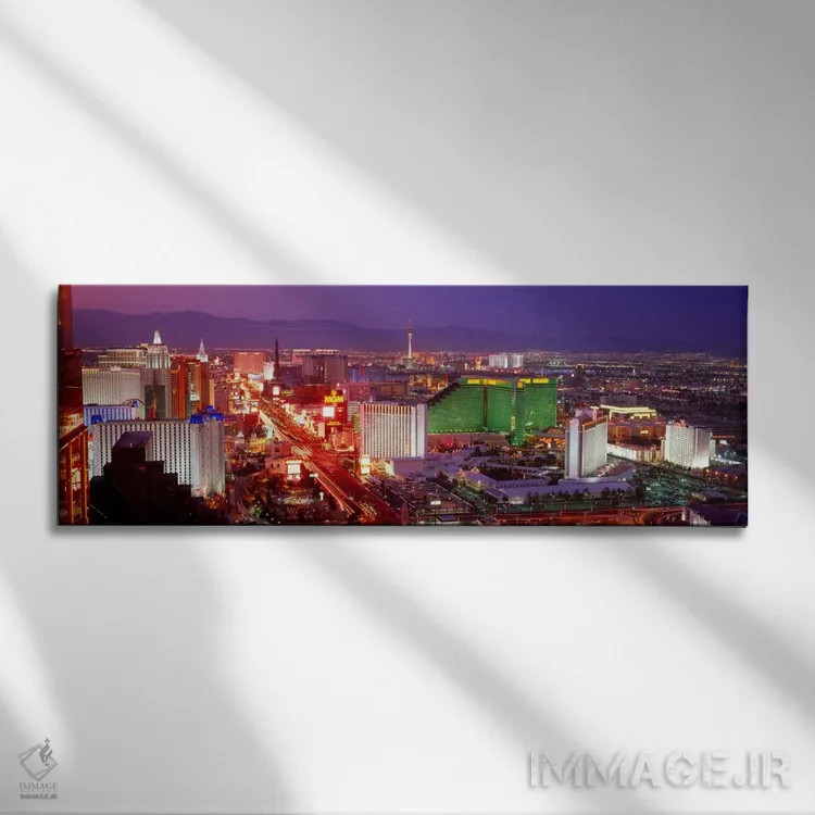 تابلو ساختمانهای روشن شده در غروب در یک شهر، لاسوگاس، شهرستان کلارک، نوادا، ایالات متحده آمریکا اثر پانورامیک ایمجز (استودیو عکاسی عریض) - نمای روبهرو روی دیوار