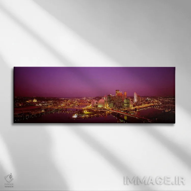 تابلو نمای بالا از ساختمانها روشن شده در شب، استادیوم سه رودخانه، پیتسبورگ، پنسیلوانیا، ایالات متحده آمریکا اثر پانورامیک ایمجز (استودیو عکاسی عریض) - نمای روبهرو روی دیوار