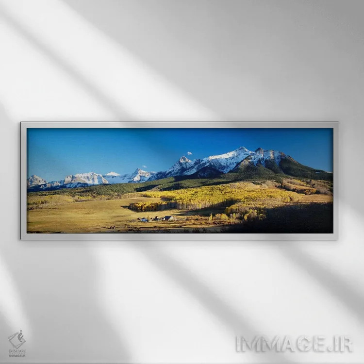 تابلو نمای هوایی از مزرعه آخرین دلار با رشته کوه اسنفلس در پسزمینه، کلرادو، ایالات متحده آمریکا اثر پانورامیک ایمجز (استودیو عکاسی عریض) - نمای قابدار سفید