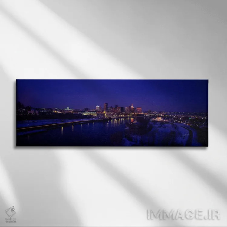 تابلو بازتاب ساختمانها در رودخانه در شب، رودخانه میسیسیپی، مینیاپولیس و سنت پل، مینهسوتا، آمریکا اثر پانورامیک ایمجز (استودیو عکاسی عریض) - نمای روبهرو روی دیوار