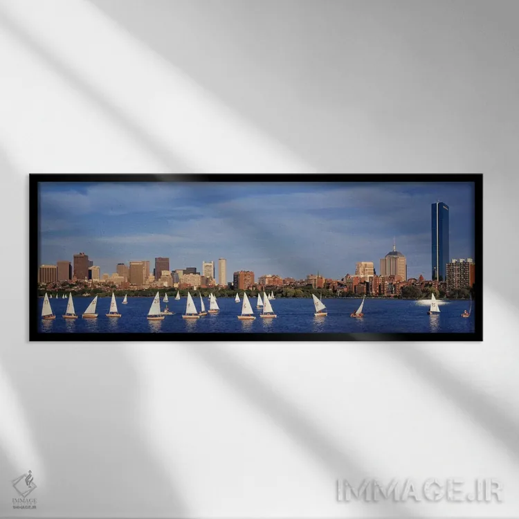 تابلو ایالات متحده، ماساچوست، بوستون، رودخانه چارلز، نمای قایقها در یک رودخانه کنار یک شهر اثر پانورامیک ایمجز (استودیو عکاسی عریض) - نمای قابدار مشکی