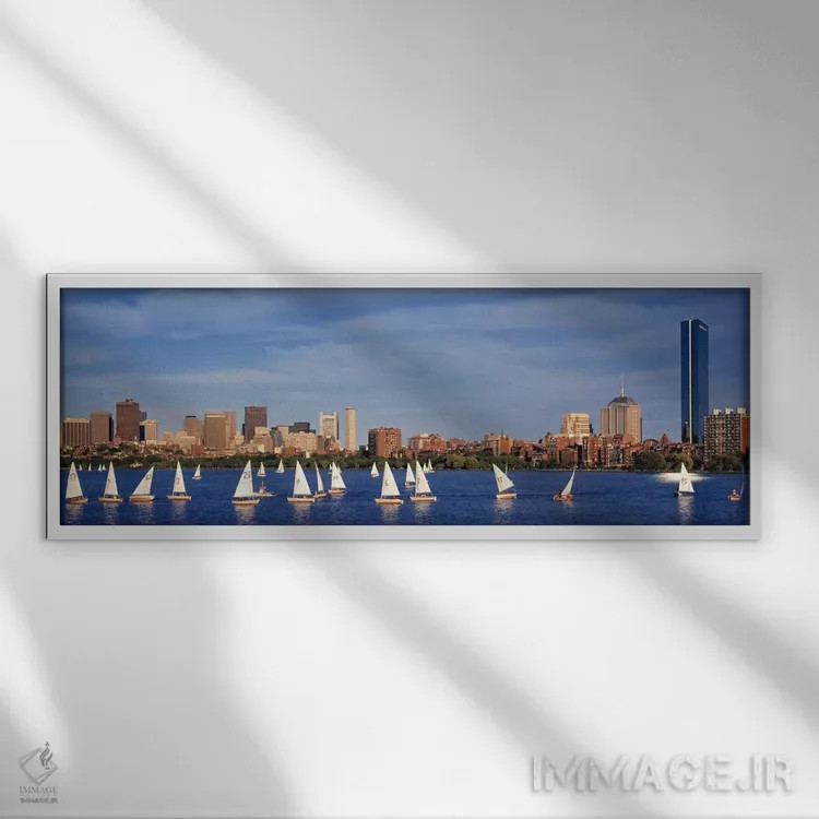 تابلو ایالات متحده، ماساچوست، بوستون، رودخانه چارلز، نمای قایقها در یک رودخانه کنار یک شهر اثر پانورامیک ایمجز (استودیو عکاسی عریض) - نمای قابدار سفید