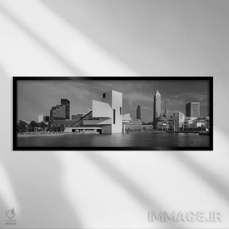 تابلو "ساختمانها در کنار ساحل، سالن مشاهیر راک اند رول، کلیولند، اوهایو، ایالات متحده آمریکا" اثر پانورامیک ایمجز (استودیو عکاسی عریض) - نمای قابدار مشکی