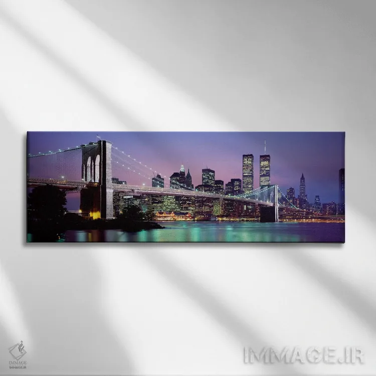 تابلو "پل بروکلین روشن شده با نمای افق منطقه مالی منهتن در پسزمینه، نیویورک سیتی، ایالت نیویورک" اثر پانورامیک ایمجز (استودیو عکاسی عریض) - نمای روبهرو روی دیوار