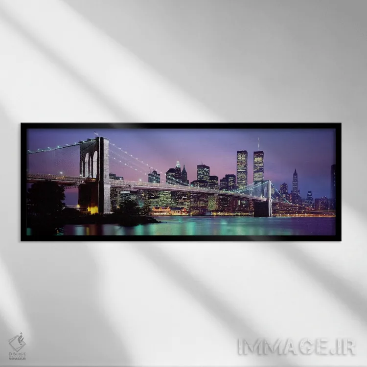 تابلو "پل بروکلین روشن شده با نمای افق منطقه مالی منهتن در پسزمینه، نیویورک سیتی، ایالت نیویورک" اثر پانورامیک ایمجز (استودیو عکاسی عریض) - نمای قابدار مشکی