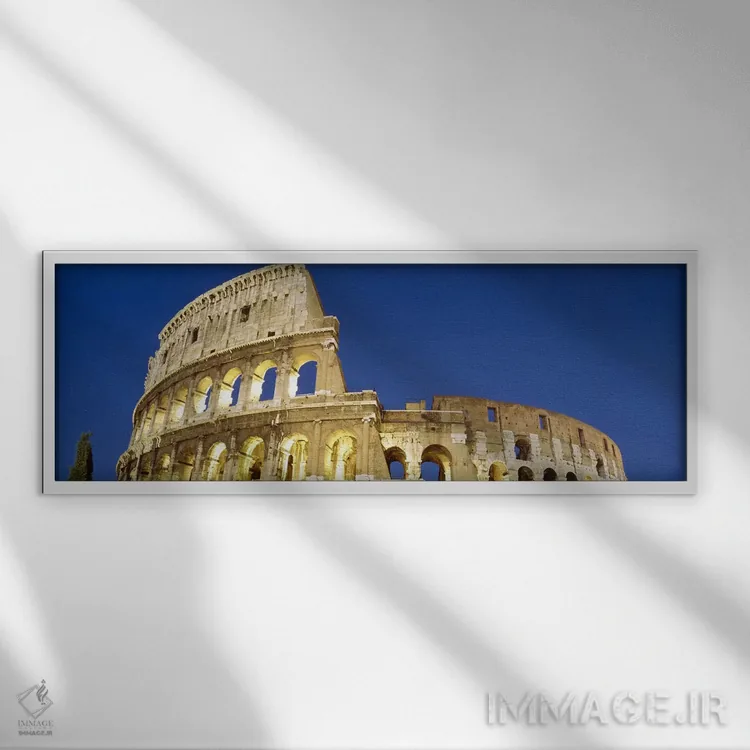 تابلو Rome, Lazio, Italy,نمای از زاویه پایین به ویرانههای یک آمفیتئاتر، کولوسئوم، رم، لاتزیو، ایتالیا اثر پانورامیک ایمجز (استودیو عکاسی عریض) - نمای قابدار سفید