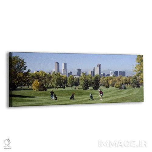 تابلو Denver, Colorado, USA,چهار نفر در حال بازی گلف با ساختمانهای پسزمینه، دنور، کلرادو، آمریکا اثر پانورامیک ایمجز (استودیو عکاسی عریض) - نمای پرسپکتیو محصول