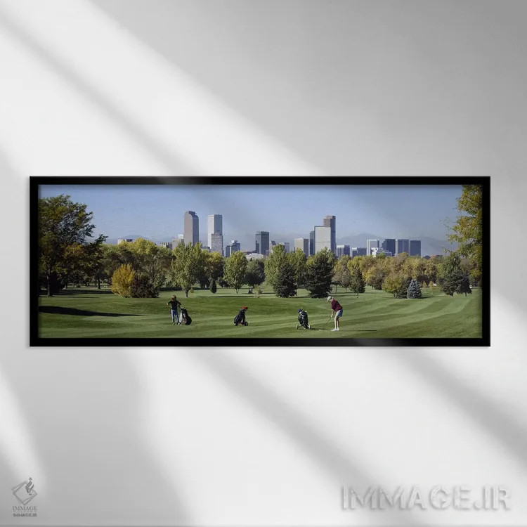 تابلو Denver, Colorado, USA,چهار نفر در حال بازی گلف با ساختمانهای پسزمینه، دنور، کلرادو، آمریکا اثر پانورامیک ایمجز (استودیو عکاسی عریض) - نمای قابدار مشکی