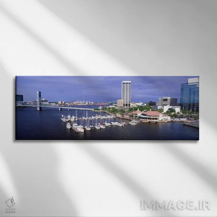 تابلو Florida, Jacksonville, St. Johns River, High angle view of Marina Riverwalk,آمریکا، فلوریدا، جکسونویل، رود سنت جانز، نمای بالا از مارینا ریورواک اثر پانورامیک ایمجز (استودیو عکاسی عریض) - نمای روبهرو روی دیوار